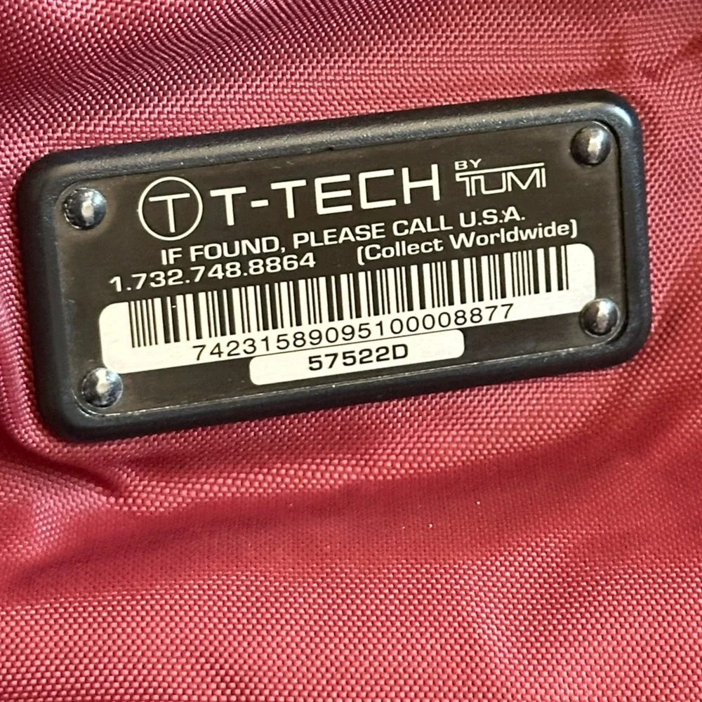 Vintage Tumi laptop/crossbody bag. Black with red lining, great find!
